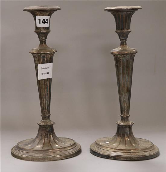 A pair of plated candlesticks height 31.5cm